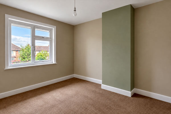 Bedroom with freshly painted walls in modern colours