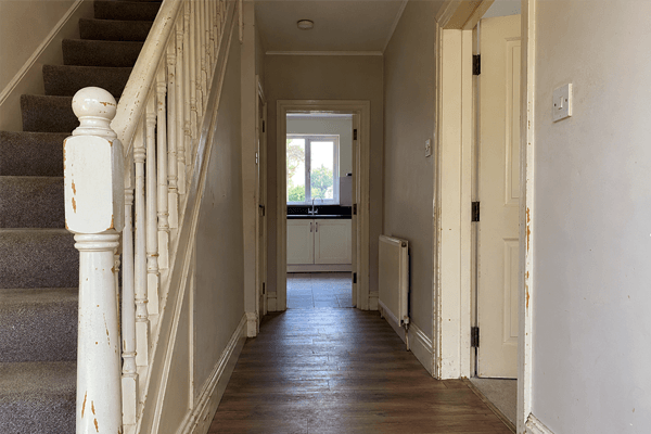 Worn interior woodwork before sanding and painting